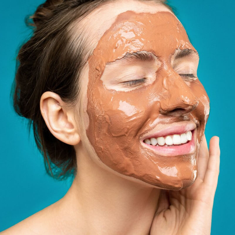is alcohol bad for skincare? woman with skincare face mask on